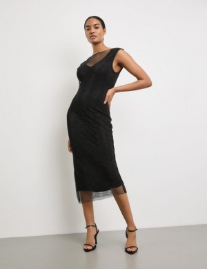 TAIFU Figure-defining mesh dress with a glitter effect Kjole Svarte | SBUY8978