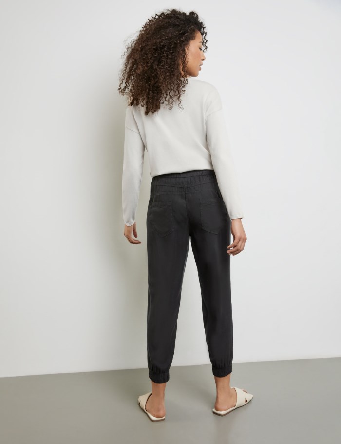 TAIFU Tracksuit bottoms with a drawstring Bukser Svarte | JACN0623